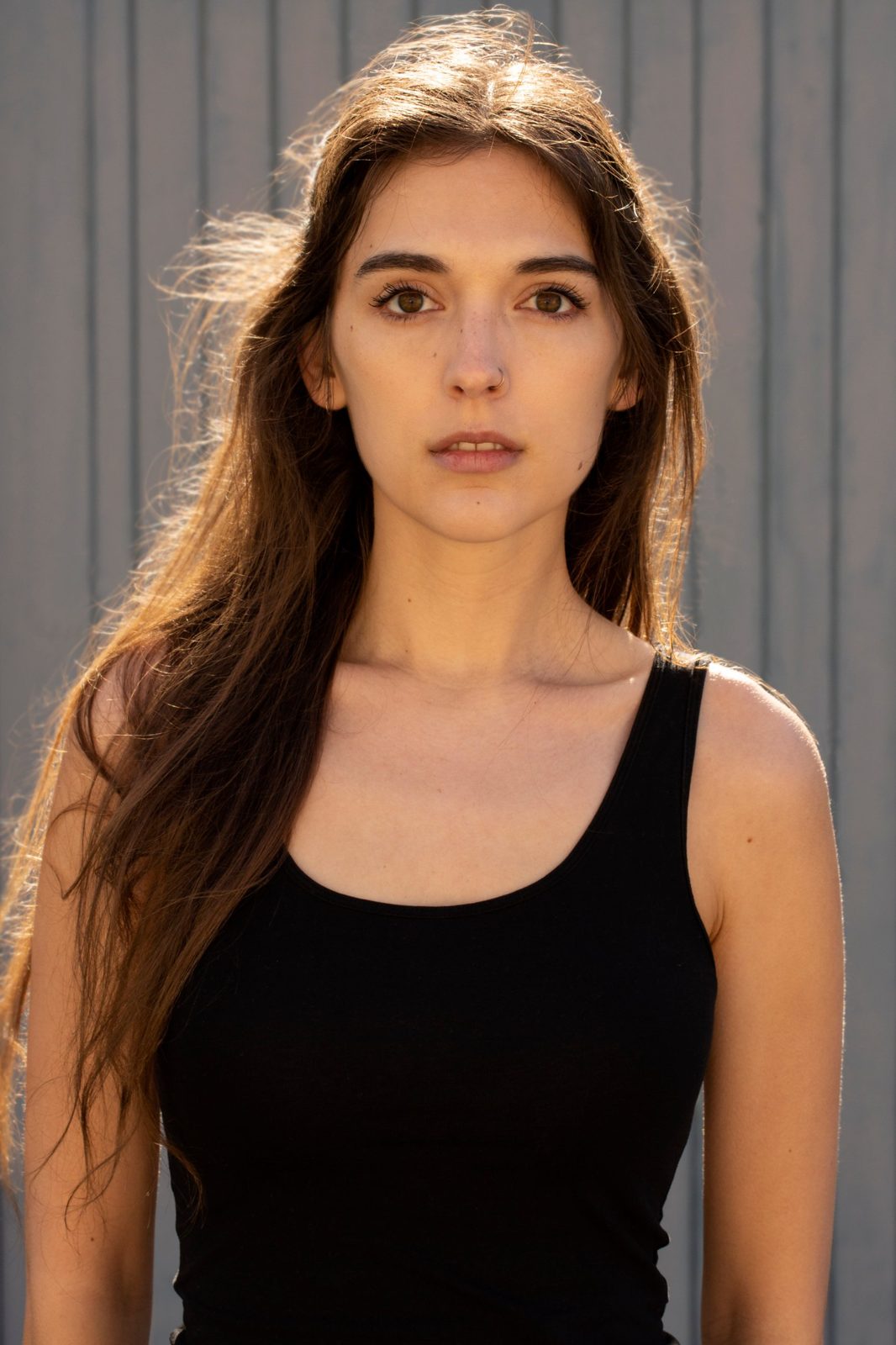 Headshot, natural light, dark hair down